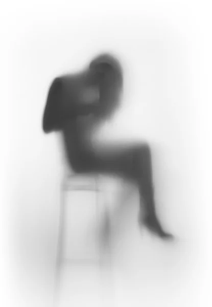 Silhouette de femme assise — Photo