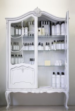 Antique cupboard, open door, medical bottles clipart