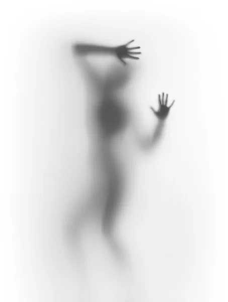 Silhueta difusa de um corpo de mulher dançante — Fotografia de Stock