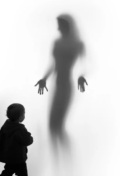 Beautiful woman silhouette vision and a young boy — Stock Photo, Image