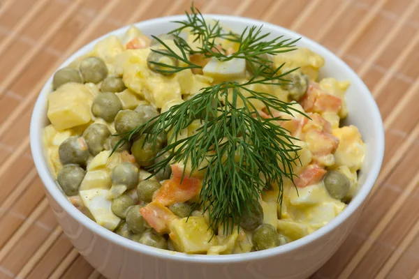 Russian traditional salad under the name Olivier — Stock Photo, Image