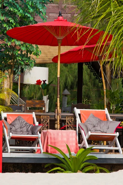 Beach umbrella and deck chairs on the beach — Stock Photo, Image