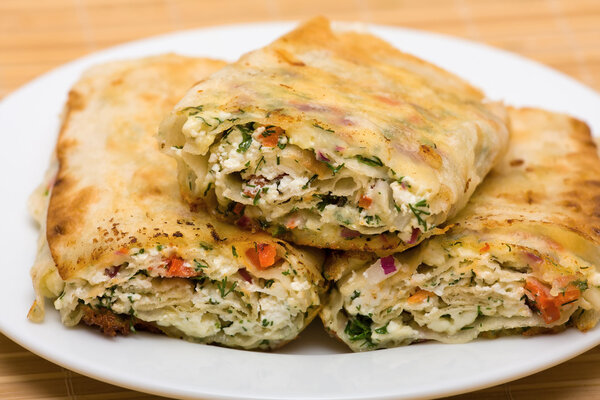 Pita bread wrapped with cottage cheese and vegetables