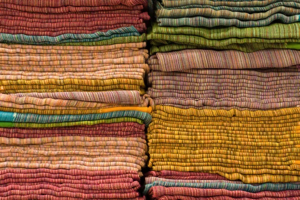 Heap of cloth fabrics at a local market in India. — Stock Photo, Image