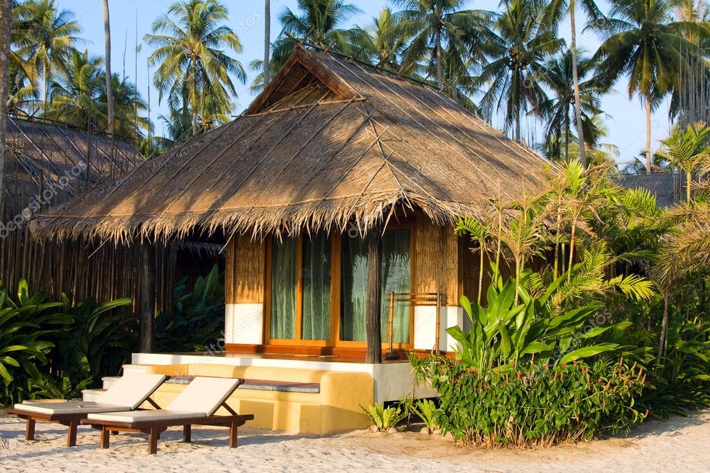Beautiful tropical beach bungalow Stock Photo by ©OlegDoroshenko 24999479