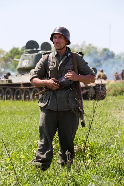 KIEV, UKRAINE -MAY 11: Member of Red Star history club wears historical German uniform during historical reenactment of WWII, May 11, 2013 in Kiev, Ukraine — Stock Photo, Image