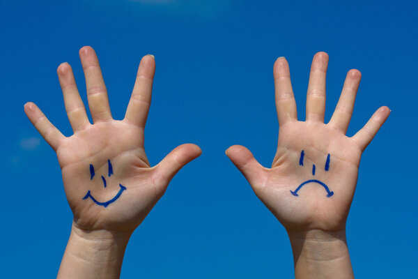 Hands with smiles and sadness pattern