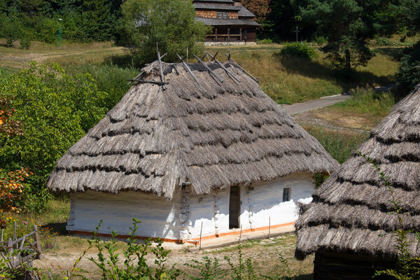 Wooden houses taken in park in summer in Pirogovo museum, Kiev, Ukraine