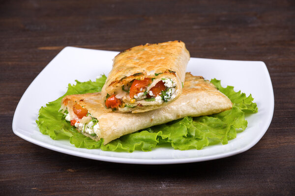 Pita bread wrapped with cottage cheese and vegetables