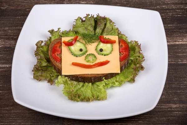 Fun food for kids - face on bread — Stock Photo, Image