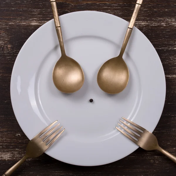 Happy face on dish plate — Stock Photo, Image