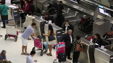 Passengers arrive at check-in counters at Suvarnabhumi Airport , Bangkok