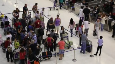 Passengers arrive at check-in counters at Suvarnabhumi Airport , Bangkok