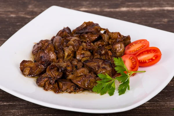 Chicken livers in a creamy sauce with onion — Stock Photo, Image