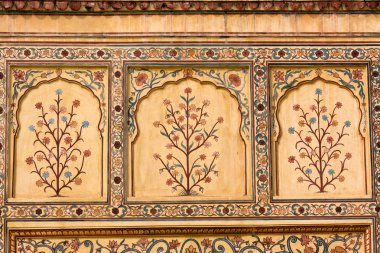 Indian ornament on wall of palace in Jaipur fort India clipart
