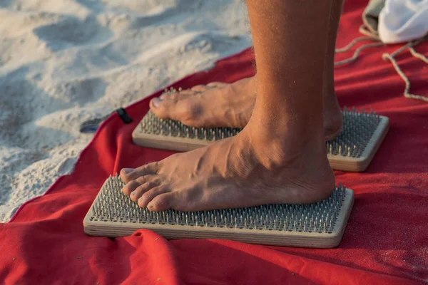Man Stands Sharp Nails Tropical Sand Beach Sunset Male Feet — Stock Photo, Image