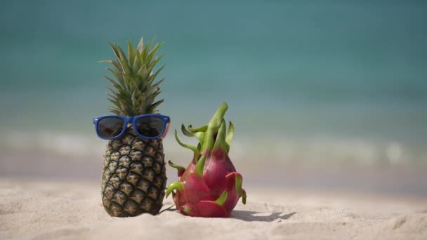 Ripe Attractive Pineapple Sunglasses Pink Dragon Fruit Sand Tropical Beach — Stock Video