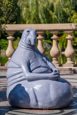 Modern sculpture Homunculus Loxodontus on the street in Kyiv, Ukraine, close up. Eternally waiting humanoid monument
