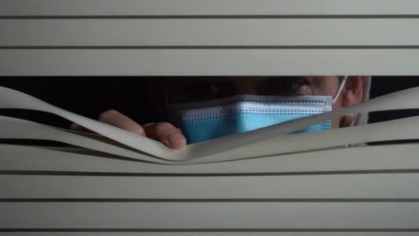 Close Front Portrait Indoors Brunette Woman Protective Mask Pushing Blinds — Video Stock