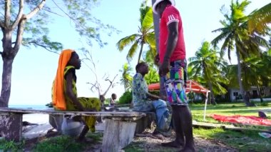 Zanzibar, Tanzania - november 30, 2019 : African guy punishes his sisters on the beach near a house on the island of Zanzibar, Tanzania, east Africa, close up