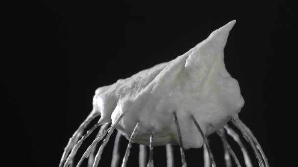 Metal Whisk Whipped Egg Whites Isolated Black Background Close Rotates — Vídeo de Stock