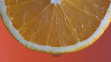 Fresh orange slice and water drop , macro, close up. Bright juicy citrus pulp closeup. Concept healthy lifestyle, vitamins, proper nutrition, diet, summer, fresh juices
