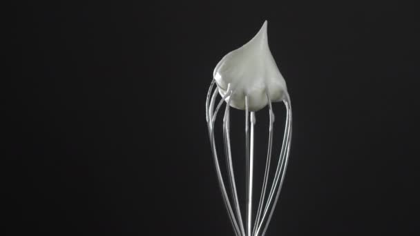 Metal Whisk Whipped Egg Whites Isolated Black Background Close Rotates — Video