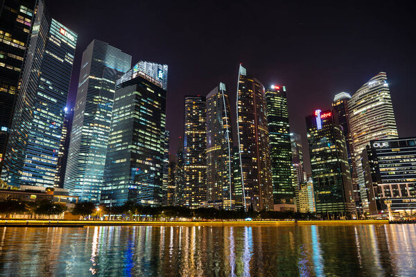 Singapore city, Singapore -march 28, 2019 : Singapore Skyline and view of skyscrapers on Marina Bay at night . Singapore cityscape of the financial district