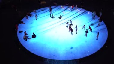 SINGAPORE CITY, SINGAPORE - MARCH 29, 2019: Large screen augmented reality experience on the floor. Children playing on Digital Light Canvas at Marina Bay Sands mall in Singapore