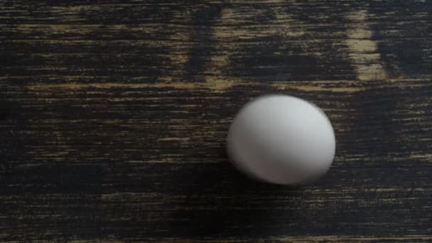 Chicken Egg Rotates Wooden Table Close Top View — Stock videók