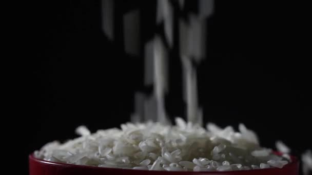 White Rice Falls Fills Bowl Table Close Shooting Black Background — стоковое видео