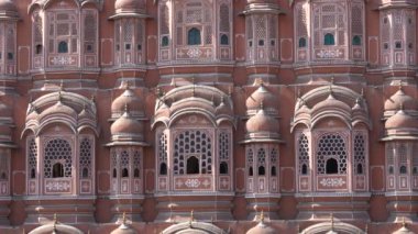 Hawa Mahal, pink palace of winds in old city Jaipur, Rajasthan, India, establishing shot. Background of indian architecture, close up