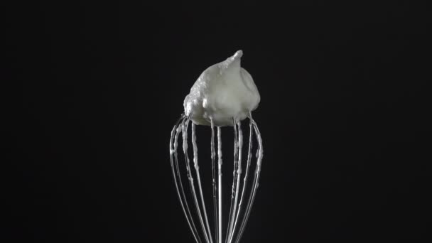 Metal Whisk Whipped Egg Whites Isolated Black Background Close Rotates — Video