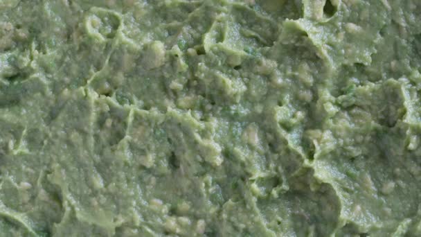 Fresh Green Avocado Pulp Rotates Background Texture Raw Mashed Avocado — Stok Video