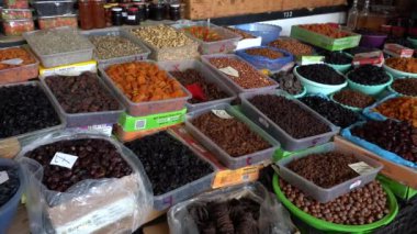 BATUMI, GEORGIA - OCTOBER 29, 2018 : Hazelnuts, walnuts, peanuts, raisin and other dried fruits sold in local street food market in Batumi, Georgia. Close up 