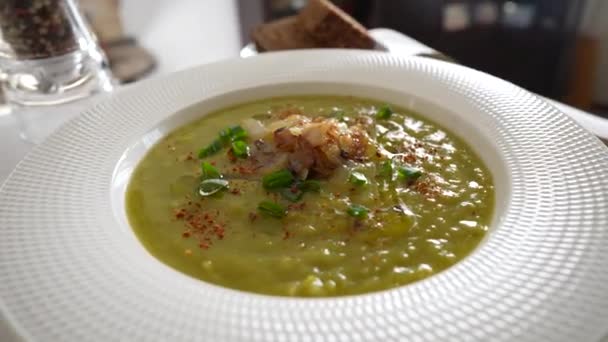 Green Pea Cream Soup White Plate Spices Table Rotate Close — ストック動画