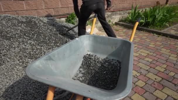 Worker Shovel Puts Rubble Wheelbarrow Close Man Help Shovel Loading — Stock Video