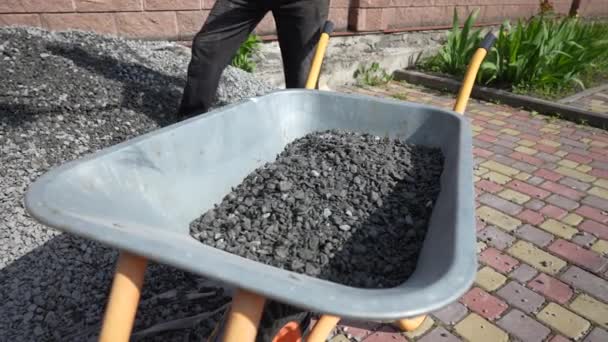 Worker Shovel Puts Rubble Wheelbarrow Close Man Help Shovel Loading — Stock Video