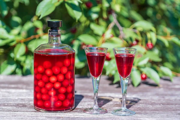Homemade Cherry Brandy Two Glasses Glass Bottle Wooden Table Summer — Stock Photo, Image
