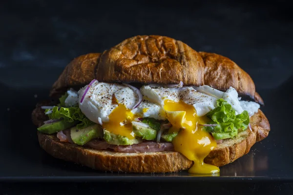 Croissant Fresh Sandwich Poached Egg Salmon Avocado Plate Black Background —  Fotos de Stock