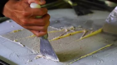 Street food in Vietnam. Cooking asian style natural fruit ice cream at night food market in Da Nang, Vietnam