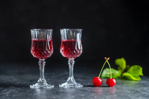 Homemade Red Cherry Brandy Two Crystal Glasses Black Background Close — Fotografia de Stock