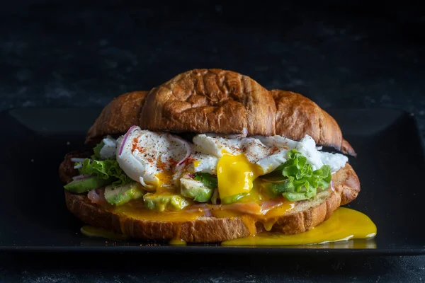 Croissant Fresh Sandwich Poached Egg Salmon Avocado Plate Black Background —  Fotos de Stock