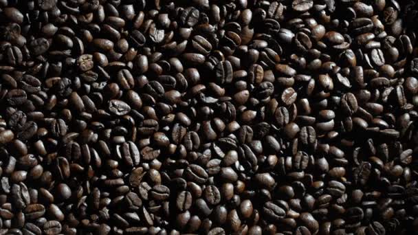 Background Fresh Roasted Coffee Beans Close Top View Rotating Dark — стоковое видео