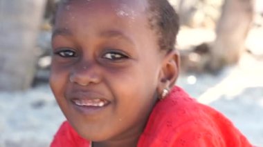 Zanzibar, Tanzania - december 11, 2019 : Young African children on the tropical sand beach in island of Zanzibar, Tanzania, east Africa, close up