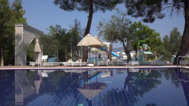 Swimming pool next to the sea in the resort hotel in Didim, Turkey. The concept of vacation and entertainment