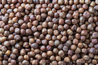 Dry hazelnuts background. Heap of peeled hazelnuts kernels, top view , close up