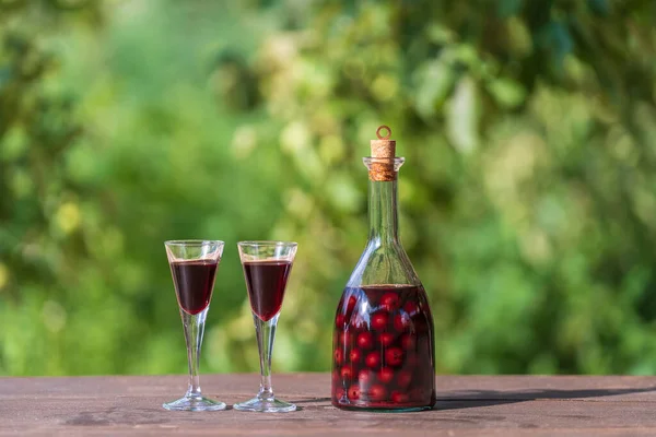 Homemade Cherry Brandy Two Glasses Glass Bottle Wooden Table Summer — ストック写真