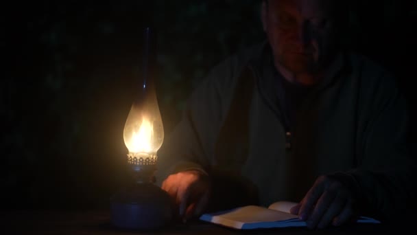 Man Writes Pencil Notebook Light Kerosene Lamp Night Time Close — 图库视频影像