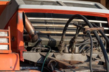 Front end and radiator of an old bulldozer, close up